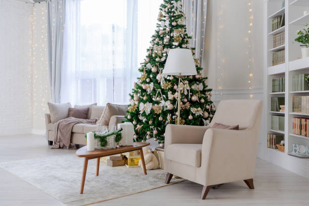 istock Luxury rich expensive apartment interior in light colors. Stylish contemporary minimalistic design. Full of sun light. A lot of space decorated with Christmas tree 1299134532