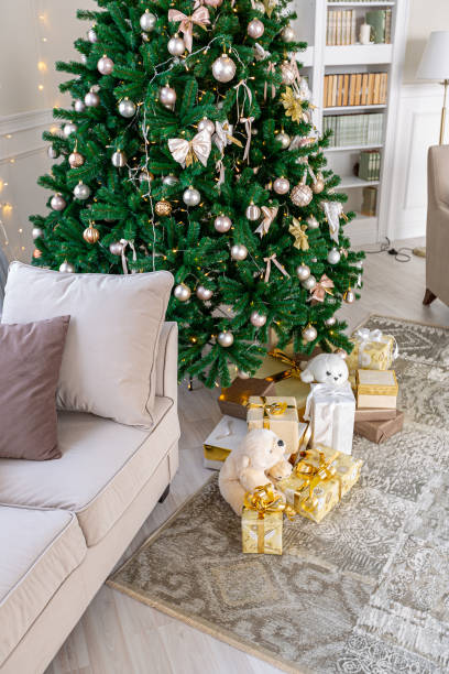 istock Luxury rich expensive apartment interior in light colors. Stylish contemporary minimalistic design. Full of sun light. A lot of space decorated with Christmas tree 1299134627