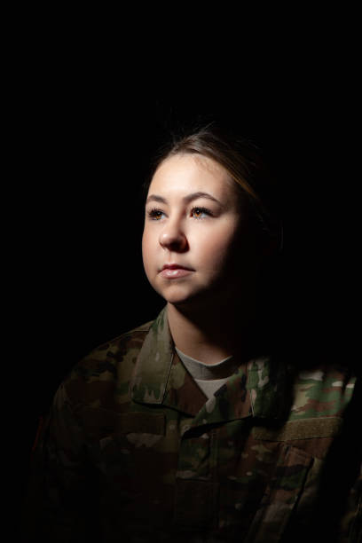 istock Dramatic Close Up of Female Soldier 1299136946