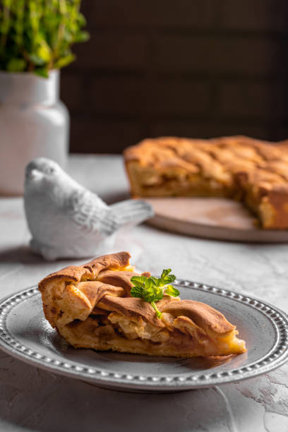 istock Homemade apple pie with mint leaves on a plate 1299138376