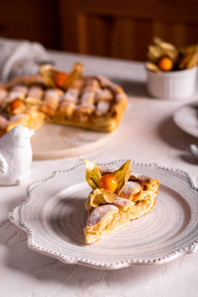 istock Homemade apple pie with fisalis on a plate 1299138433
