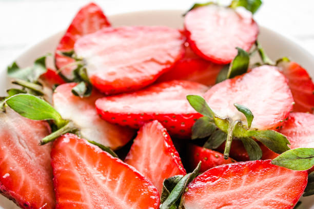 istock Fresh strawberries. Plate with juicy strawberry slices. 1299138471