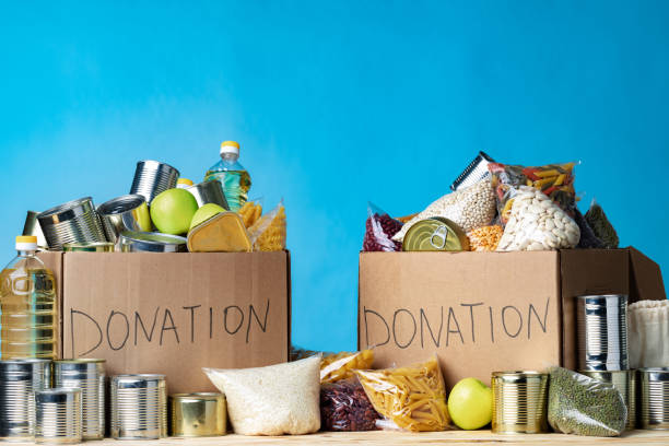 istock Food donations on the table. Text Donation. 1299143315