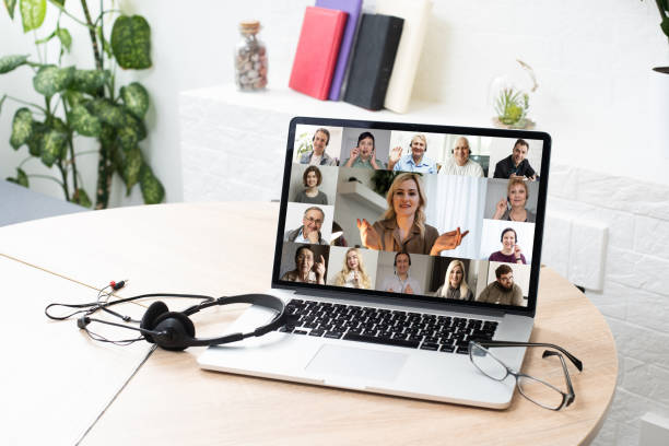 istock Many portraits faces of diverse young and aged people webcam view, while engaged in videoconference on-line meeting lead by businessman leader. Group video call application easy usage concept 1299143482