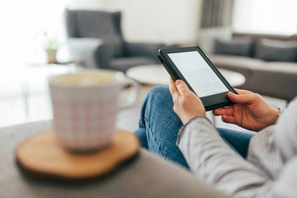 istock Woman Reading E-Book at Home 1299147646