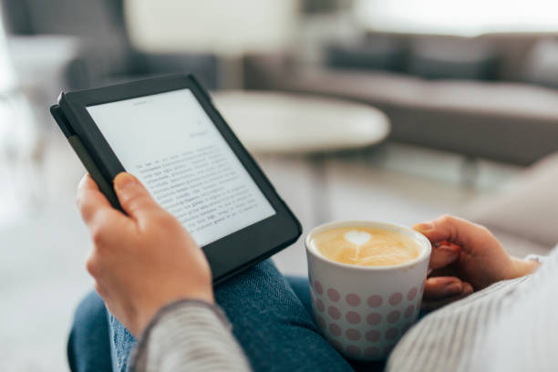 istock Woman Reading E-Book at Home 1299147666