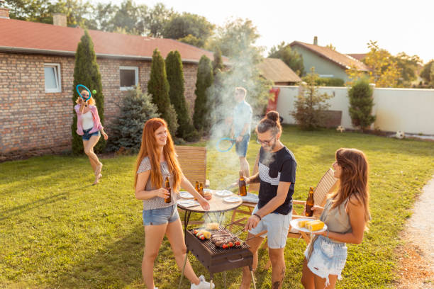 istock Friends having fun at backyard barbecue party 1299147677