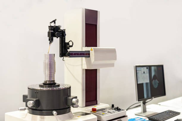 istock Machining cylindrical metal part set on work turntable on roundness cylindricity and straightness measuring tester machine and during inspection 1299148054