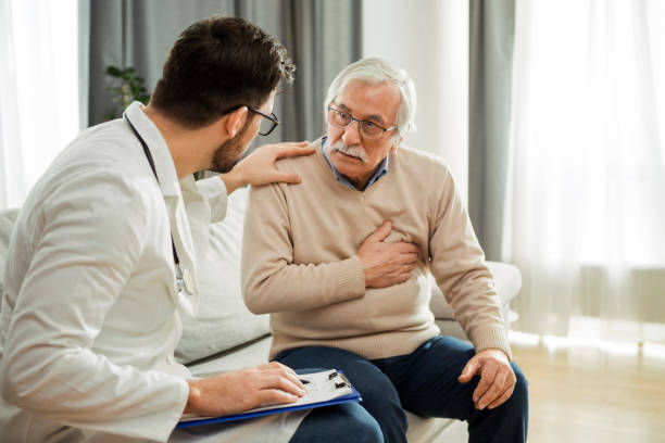 istock Young doctor and senior man having a conversation about heart condition 1299148057