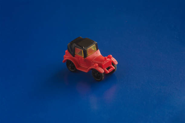 istock Toy red and black car racing down the imaginary road. 1299148255