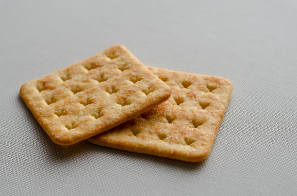Table water crackers in wooden wicker basket on wood table