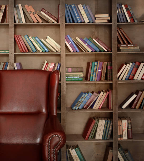 istock Old library interior with bookcase and leather armchair 1299148518