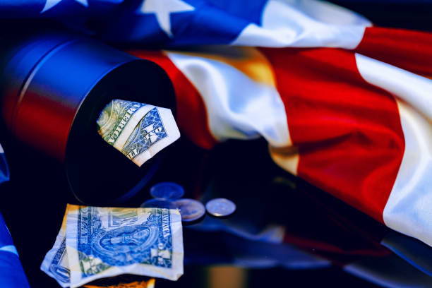 istock Oil prices fall concept. Oil barrel against decline chart 1299149430
