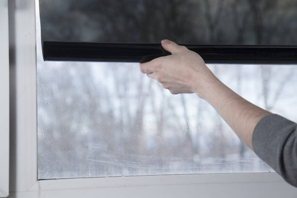 istock Installation of window film in the office. 1299149498