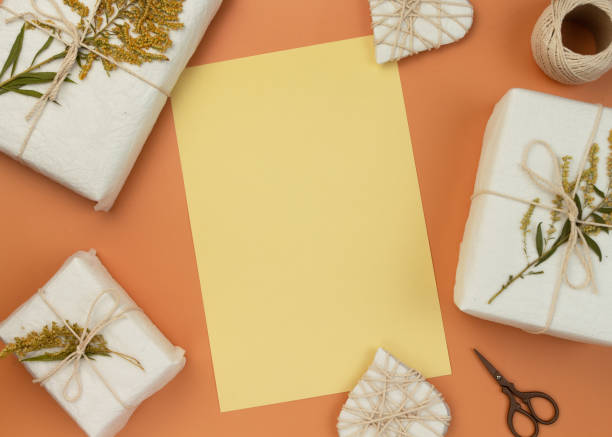 istock Valentine's Day Zero Waste Concept. Eco-friendly craft paper packaging. Gift Box with a branch of a dried flower tied with jute. Fabruary calendar. 1299151638