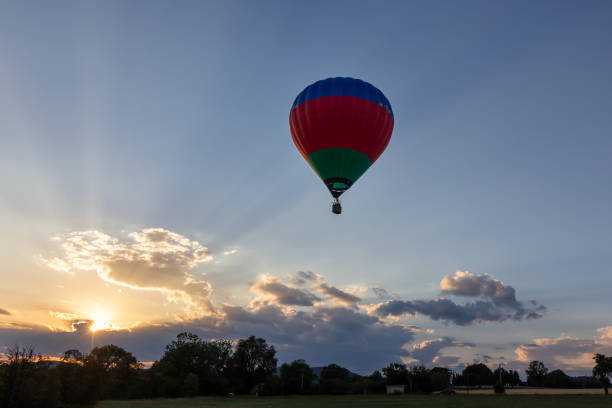 istock Hot-air balloon flying to the sun 1299153191