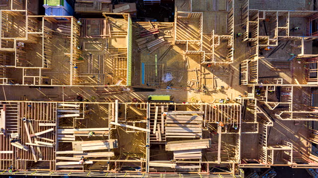 An aerial top down hyperlapse of construction work.