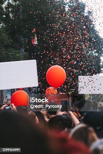 istock Crowd, balloons and confetti 1299154991