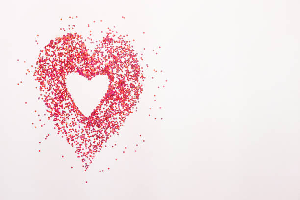 istock heart of gold and red sequins on a white background 1299155994