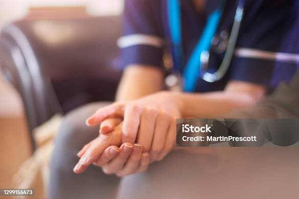 Nurse Comforting Patient Stock Photo - Download Image Now - Hospice, Doctor, Holding Hands