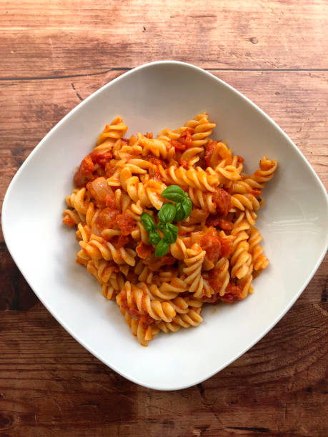 istock Fusilli alla napoletana. Pasta with tomato sauce and basil. 1299157191