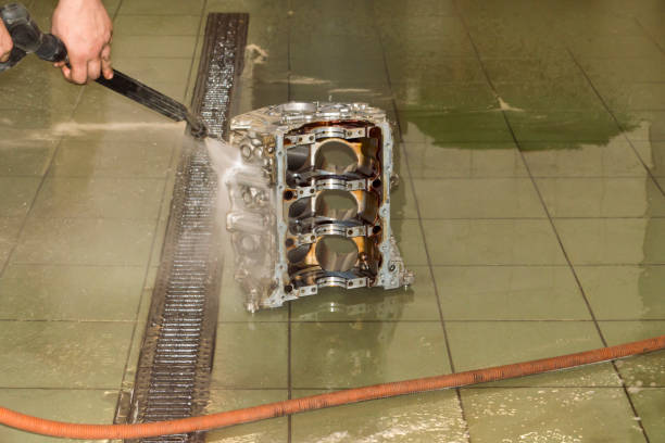 istock Washing the engine with a pressurized water jet on the side 1299157768