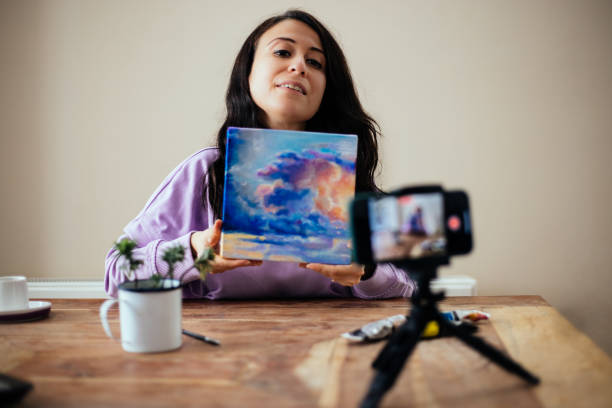 istock Vlogger recording video about how to learn painting by herself 1299159883
