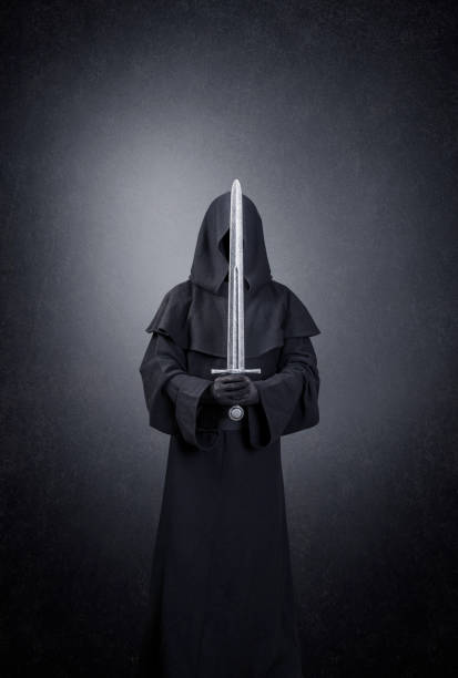 istock Ghostly figure with medieval sword in the dark 1299163201