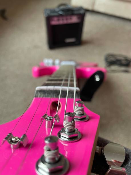 istock Pink electric guitar and amp 1299163286