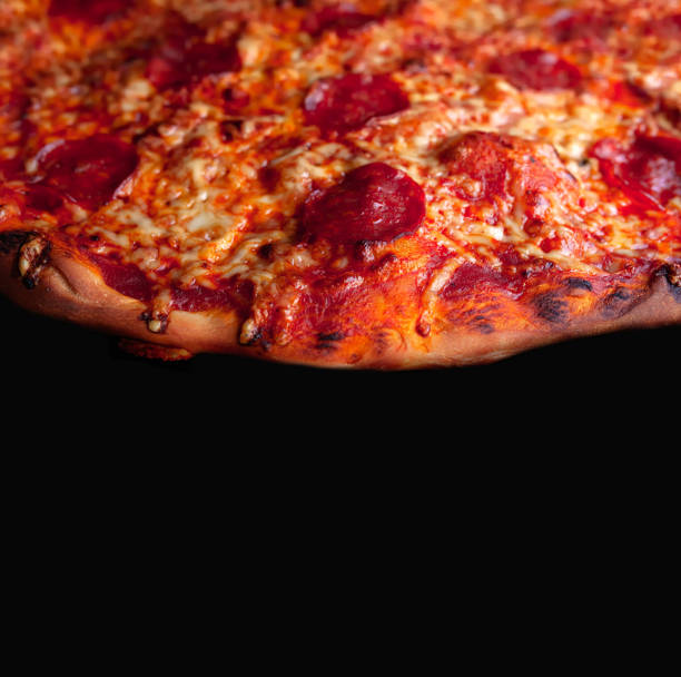 istock Homemade pizza with cheese mozzarella and pepperoni and black copy space 1299163304