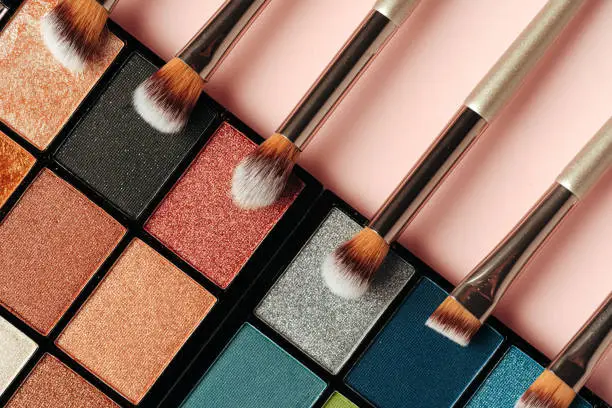 Photo of Make-up palette and brushes. Professional eyeshadow palette.