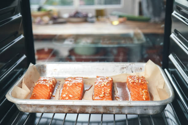 istock Preparing Spicy Salmon Bowl with Rice, Carrots, Cucumber and Avocado 1299167984