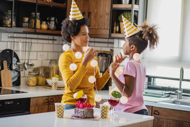 istock Birthday celebration at home with mother 1299168638