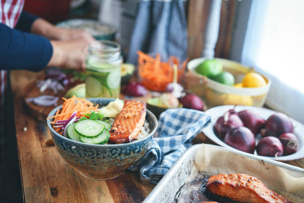 Spicy Salmon Bowl with Rice, Carrots, Cucumber and Avocado
