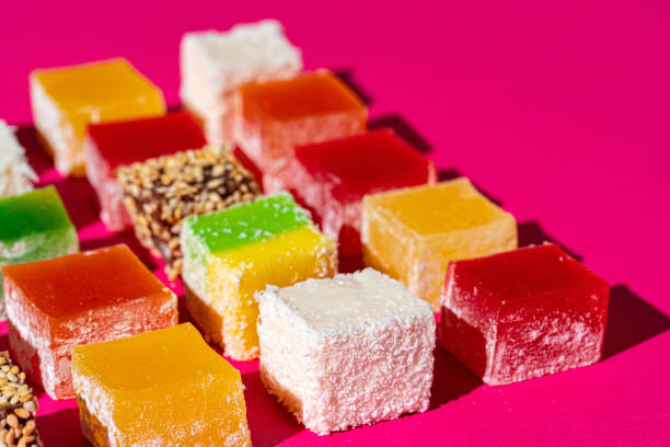 istock Turkish delight square pieces on a bright pink background 1299169847
