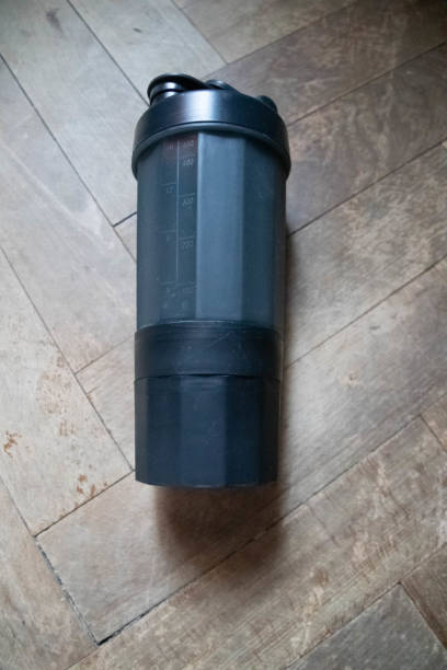 istock Gym shaker on the floor.Grey with 3 compartments. 1299170010