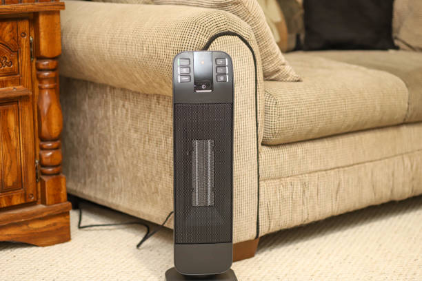 A space heater in a living room in a home stock photo