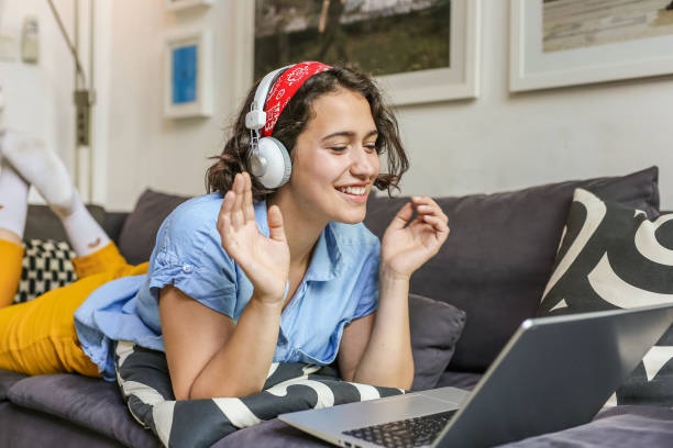istock Young woman is communicating on a video call at home 1299172142
