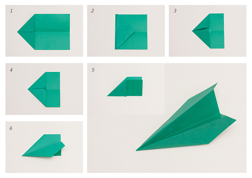 Paper plane, origami. DIY concept. Step by step handmade toy.