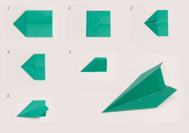 istock Paper plane, origami. DIY concept. Step by step handmade toy. 1299172529