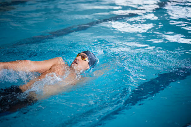 istock Disabled amputee athlete swimming side crawl in indoor pool 1299173432