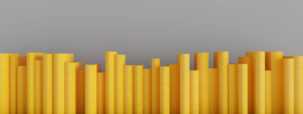 istock yellow books stacked vertically on gray wall 1299173435