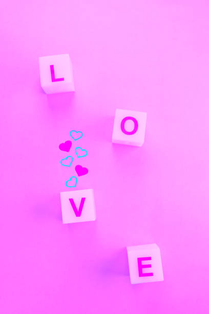 istock Letters on squares boxes for word love and small hearts 1299173469