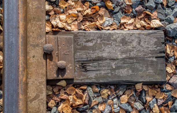 Railroad tracks in heavy rain, water reflections abstract. Wet train tracks, water on railway closeup, detail. Sad, melanholic view, nobody. Relaxation background, relaxing rain, calm, serene scene