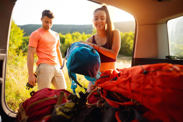istock Smiling backpackers getting ready for long hiking tour 1299175720