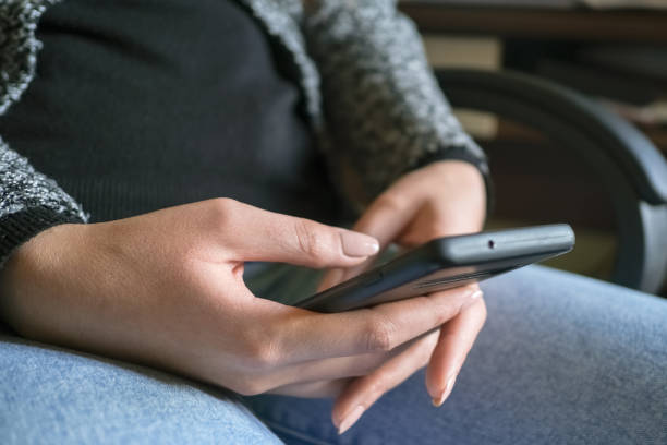 istock Woman using smartphone for messaging chat on a smartphone,social network tech addiction 1299180046