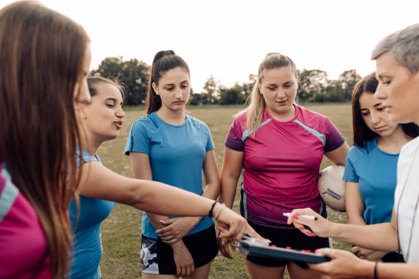 istock Female rugby team planning their playing tactic 1299180763