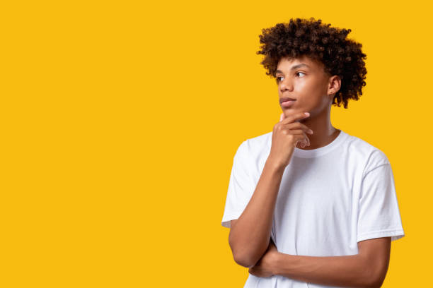 istock pensive black teenager think idea confused student 1299185349
