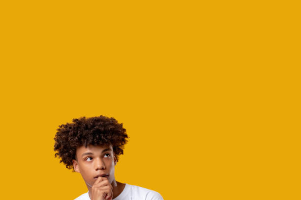 istock pensive black teenager think idea young guy 1299185359