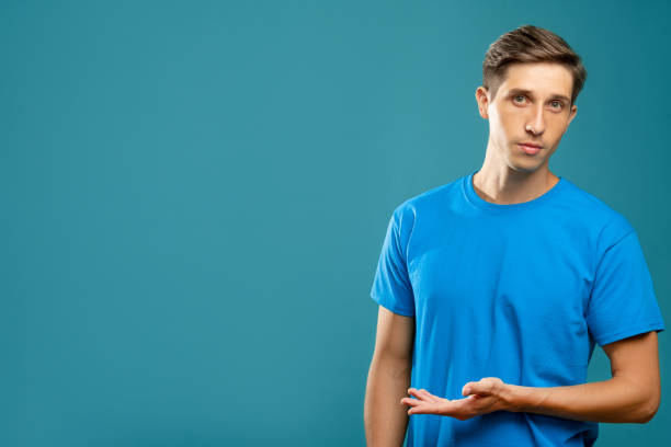 istock confused man welcome gesture information banner 1299185400